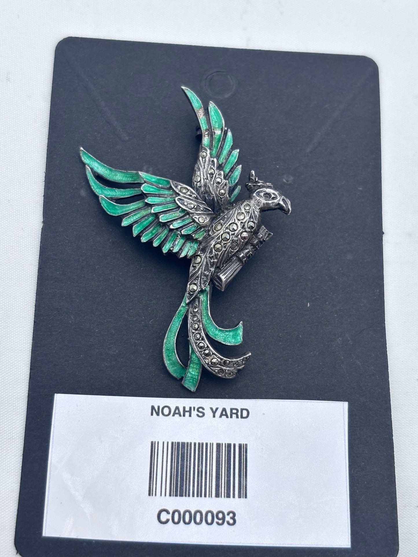 Silver and green enamel parrot brooch